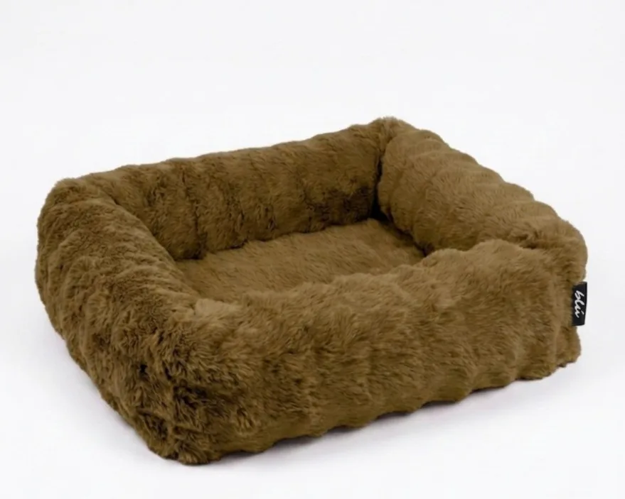 The Bliss Bed in Olive — an olive-green bolster bed in deep, plush faux fur.